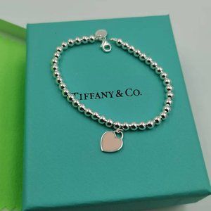 Tiffany & Co. Silver Beaded Bracelet with Pink Heart Charm